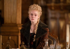 Elle Fanning as Catherine sits at her desk while looking unfocused and forlorn in The Great Season 3 Episode 9, "Destiny."