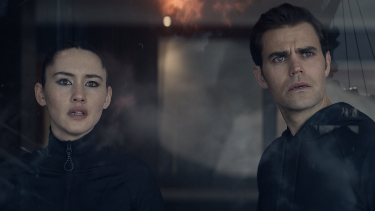 Christina Chong as La’an and Paul Wesley as Kirk in the trailer for season 2 of Star Trek: Strange New Worlds, streaming on Paramount+, 2023. They witness the bridge explosion outside their hotel room window.