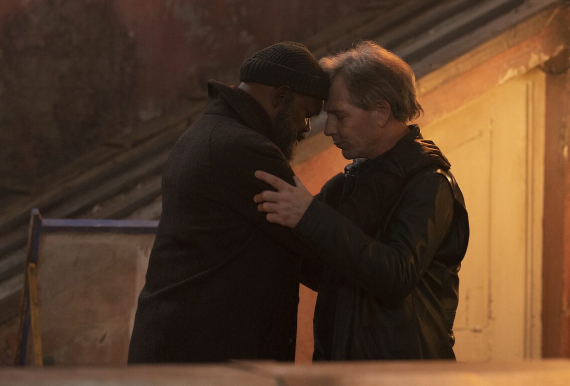 Nick Fury (Samuel L. Jackson) embraces Talos (Ben Mendelsohn). The pair touch foreheads. They're standing in a dilapidated Russian apartment in the first episode of Secret Invasion. 