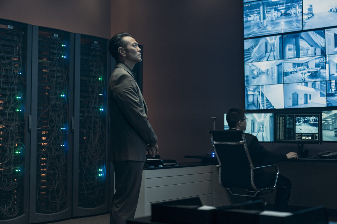 Chao Fah (Louis Ozawa) monitors security feeds in a tech suite in Tom Clancy's Jack Ryan