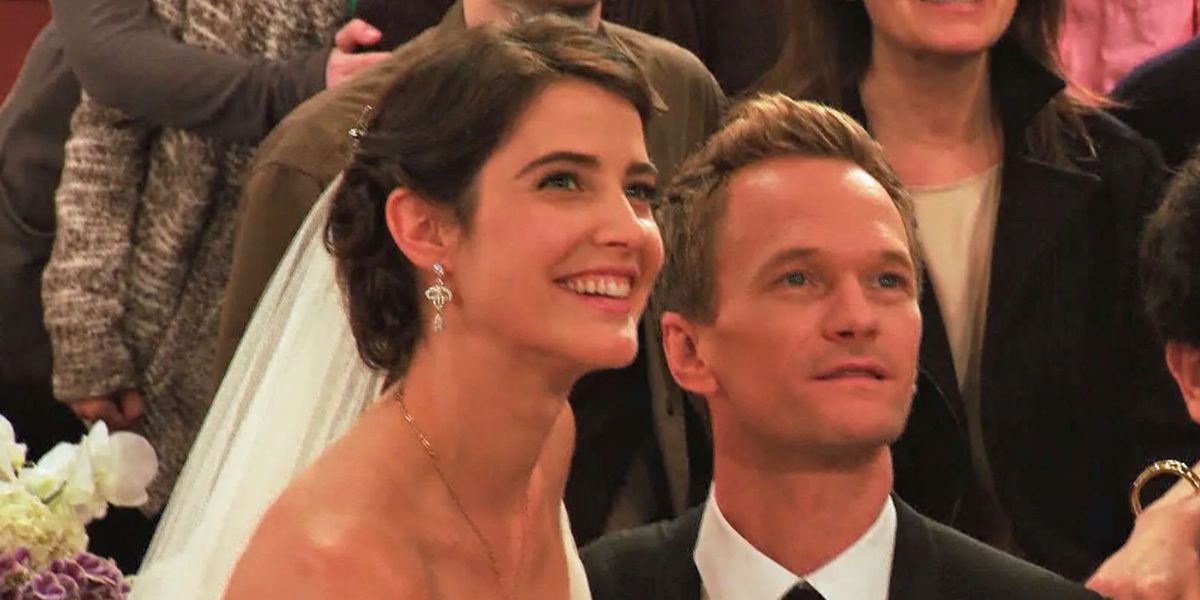Robin and Barney smiling in their wedding outfits.