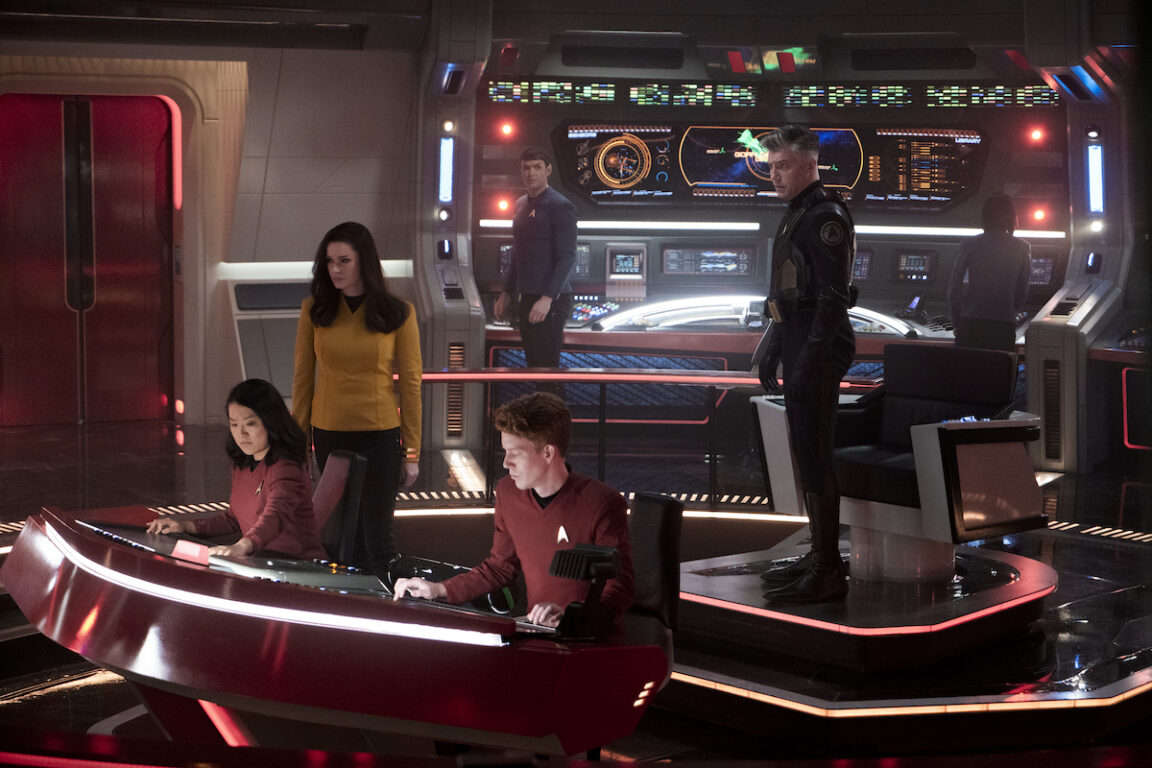 Rong Fu as Mitchell, Rebecca Romijn as Una, Ethan Peck as Spock and Anson Mount as Capt. Pike in Star Trek: Strange New Worlds' season 2 finale, "Hegemony." Pike is wearing his anti-gorn outfit. Ortegas is missing.