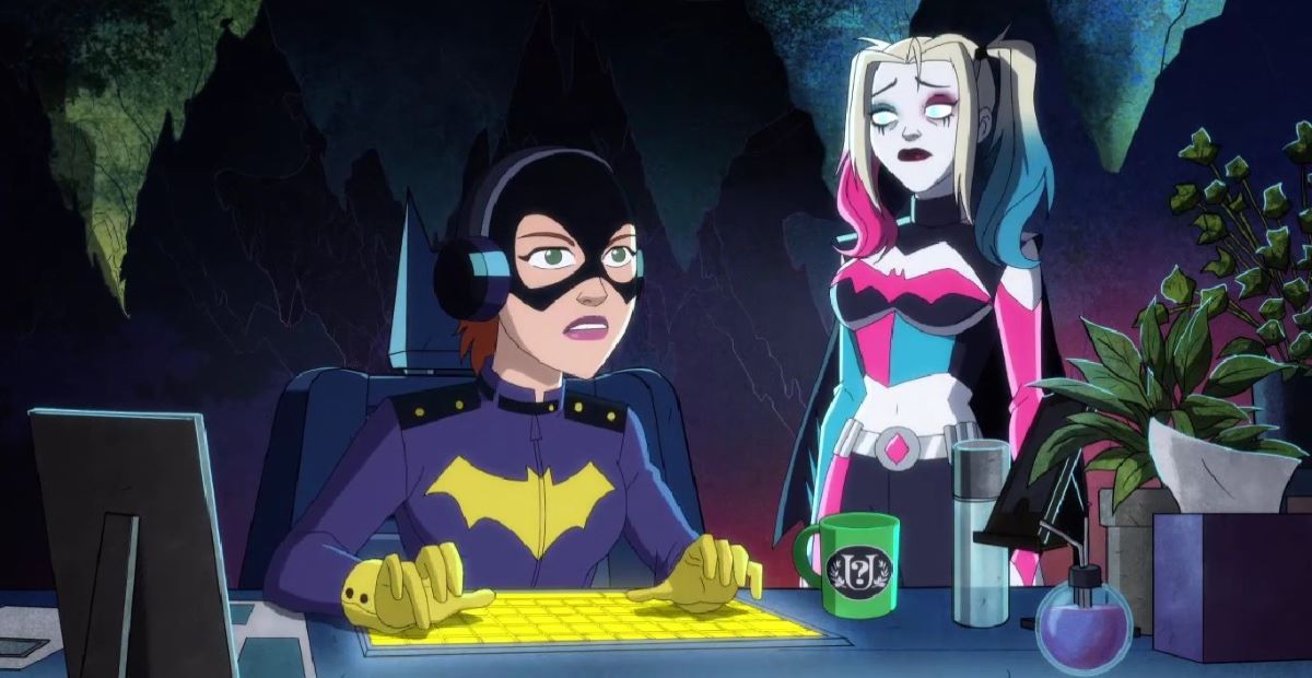 Batgirl sits at the Batcave console while wearing headphones as Harley stands over her shoulder while looking exhausted in Harley Quinn Season 4 Episode 7, "The Most Culturally Impactful Film Franchise of All Time."