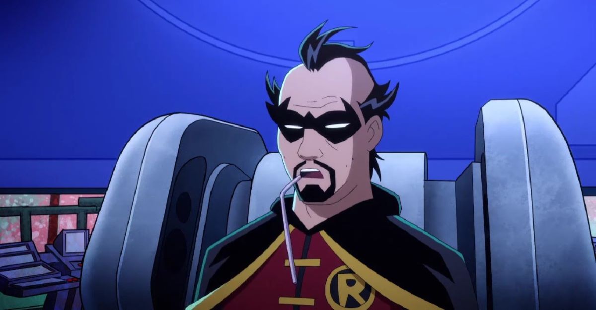 Middle-aged Robin sits in a chair in the Batcave with patches of hair on his head in Harley Quinn Season 4 Episode 7, "The Most Culturally Impactful Film Franchise of All Time."