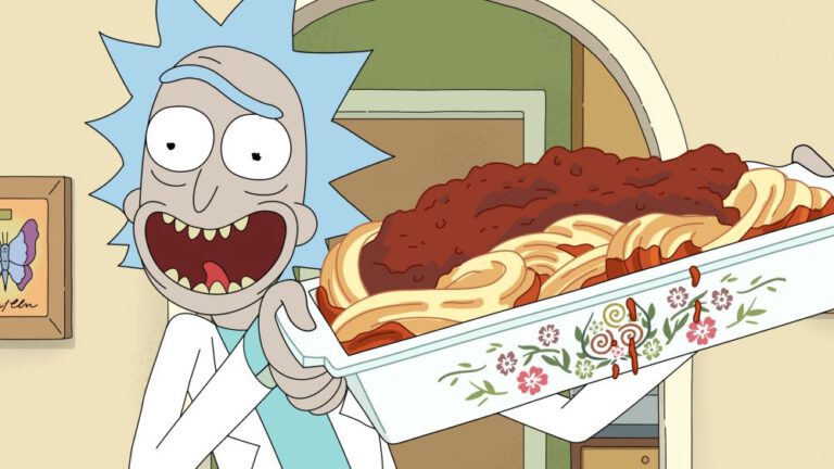 Rick Sanchez holds a pan of spaghetti while standing in his living room and smiling in Rick and Morty Season 7.
