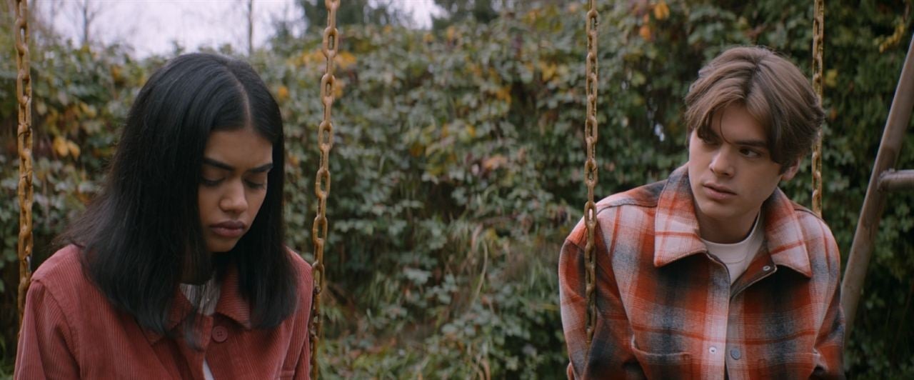 Sam (Megan Suri) and Russ (Gage Marsh) sit on the swings and talk in It Lives Inside