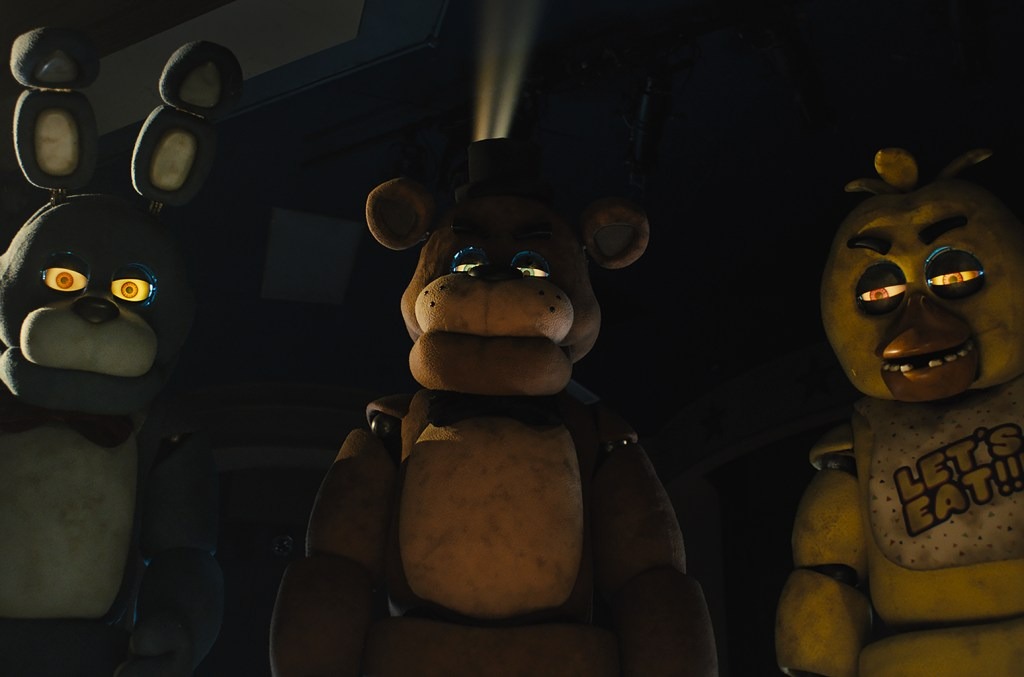 Animatronics Bonnie (Jade Kindar-Martin), Freddy (Kevin Foster) and Chica (Jessica Weiss) loom above in Five Nights at Freddy's