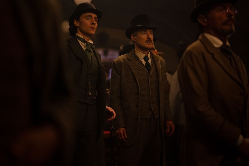 Loki and Mobius wear 19th-century suits while standing in a theater in Loki Season 2 Episode 3, "1893."