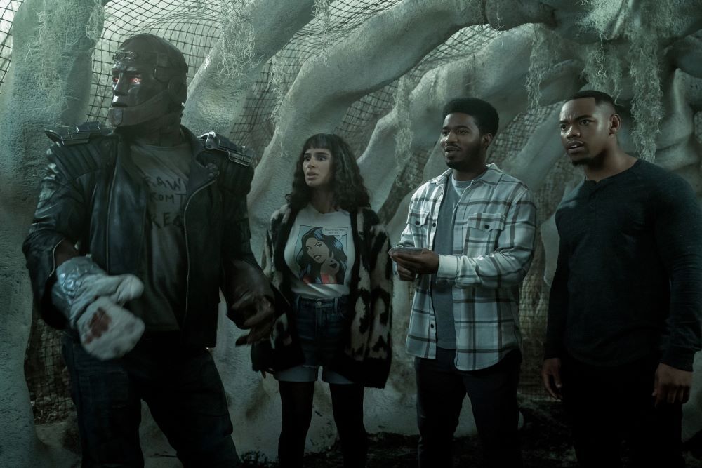 Cliff, Jane, Deric and Vic stand in a prison made of bones while looking at something excitedly in Doom Patrol Season 4 Episode 7, "Orqwith Patrol."