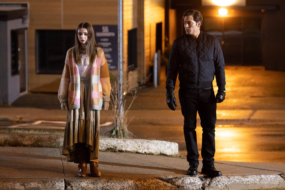 Luke stands next to Anya, a ghost, outside a hospital at night in SurrealEstate Season 2 Episode 9, "Dearly Departed."