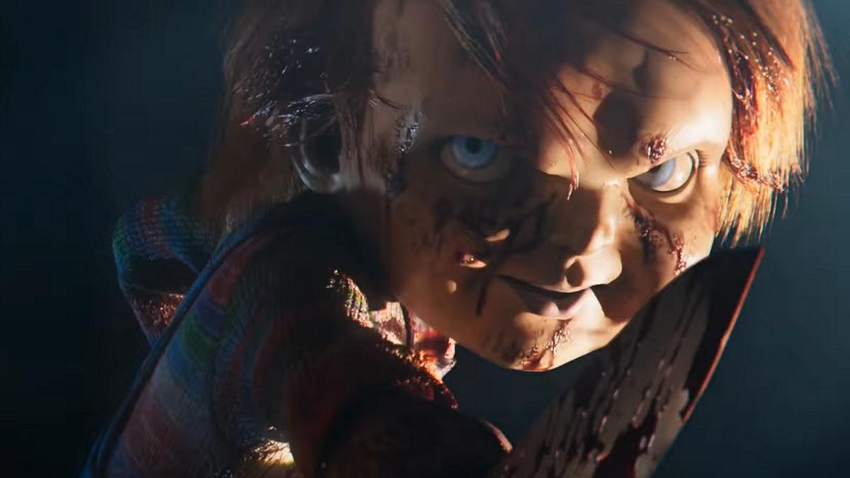 Chucky, the Good Guy Doll, smiling with his knife.