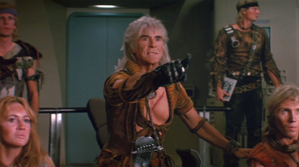 Khan (Ricardo Montalban) points from the center seat of the Reliant. He's surrounded by his augments.