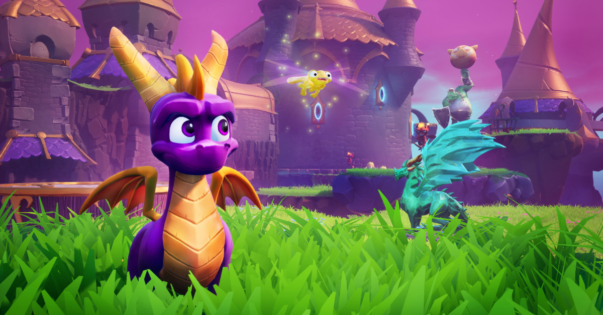 A young purple dragon stands next to a crystal dragon statue in front of a castle.