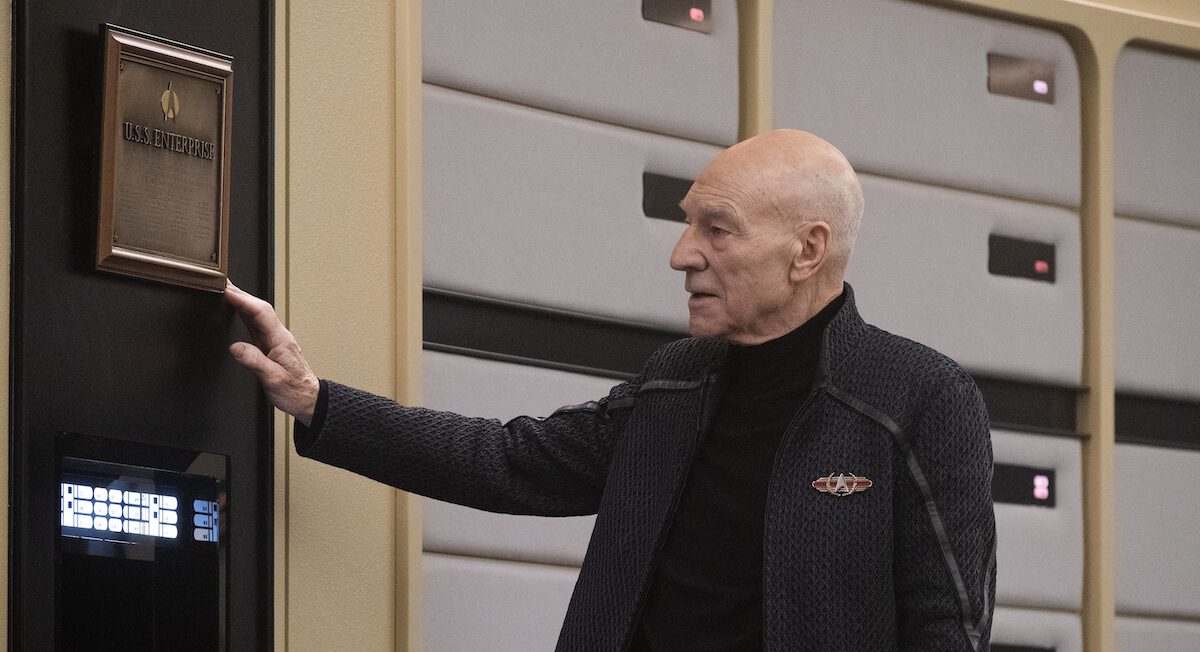 Jean-Luc Picard (Patrick Stewart) touches the ship's plaque on the bridge of the USS Enterprise-D in Star Trek: Picard.