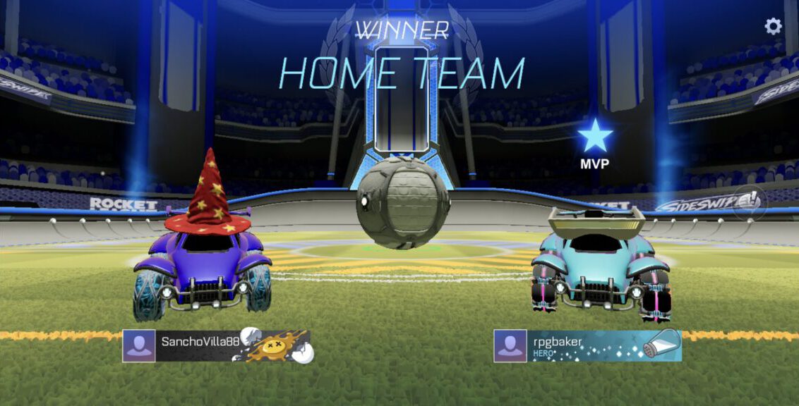 A victory screen for a doubles match. Featuring a car with a wizard's hat and another with roboglasses.