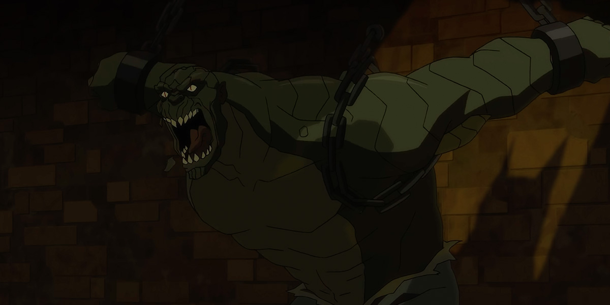Killer Croc in chains in Arkham Asylum. He is enormous, pulling at the chains.