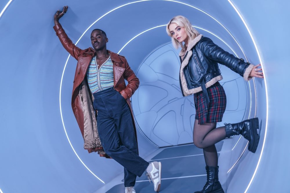 The Fifteenth Doctor and Ruby Sunday pose in a light blue tunnel for a promotional photo for Doctor Who Season 1.