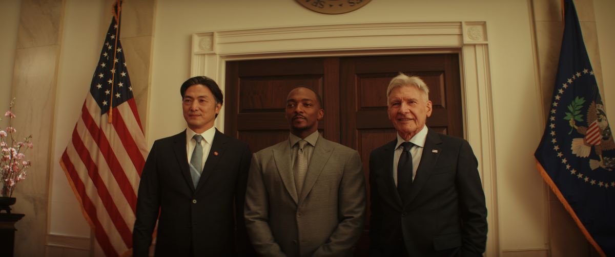 Sam Wilson and Thaddeus Ross pose for a photo with a diplomat in the White House in the Marvel film Captain America: Brave New World.