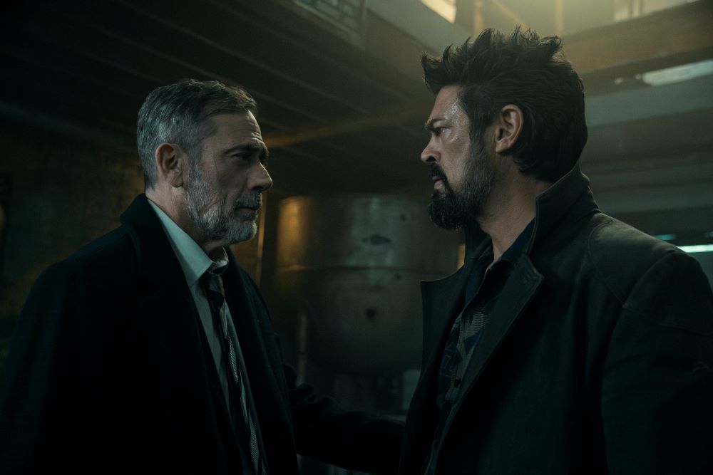 Joe Kessler and Billy Butcher stand in a dimly lit room while in a serious conversation on The Boys Season 4 Episode 6, "Dirty Business."