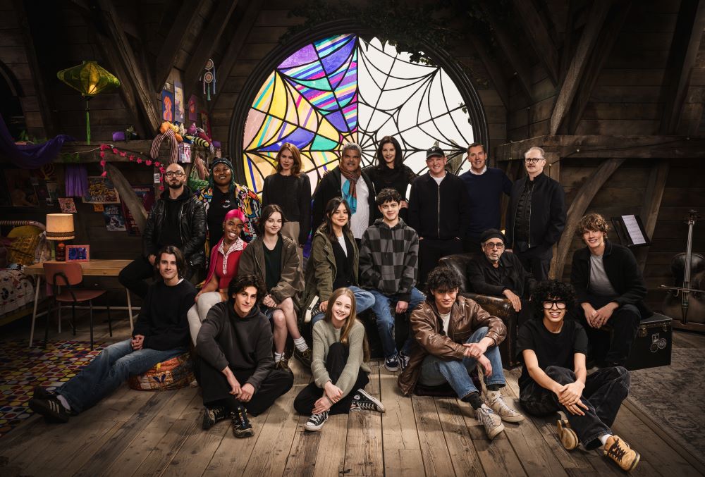 The cast and crew of the Netflix series Wednesday pose for a photo before shooting Season 2 on the show's set.
