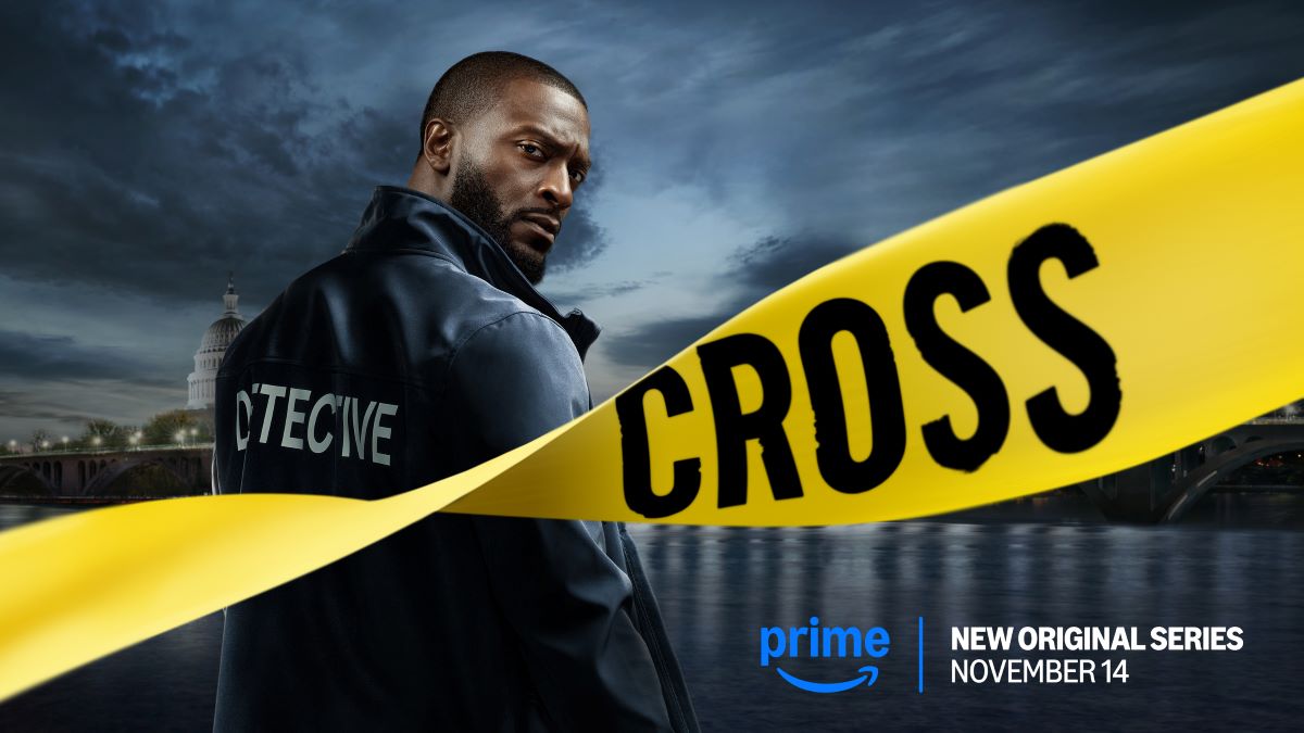 Alex Cross looks over his right shoulder at the camera. A strip of yellow police tape dominates the foreground, the word "CROSS" visible in the twist. The back of Cross's jacket read, "DETECTIVE" Cross Premieres on Prime Video November 14
