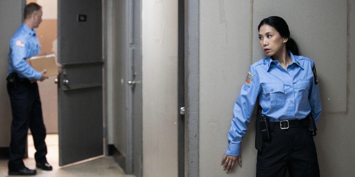 Mel hiding behind a wall in a guard uniform on The Equalizer Season 5 Episode 6, "The Fight for Life."
