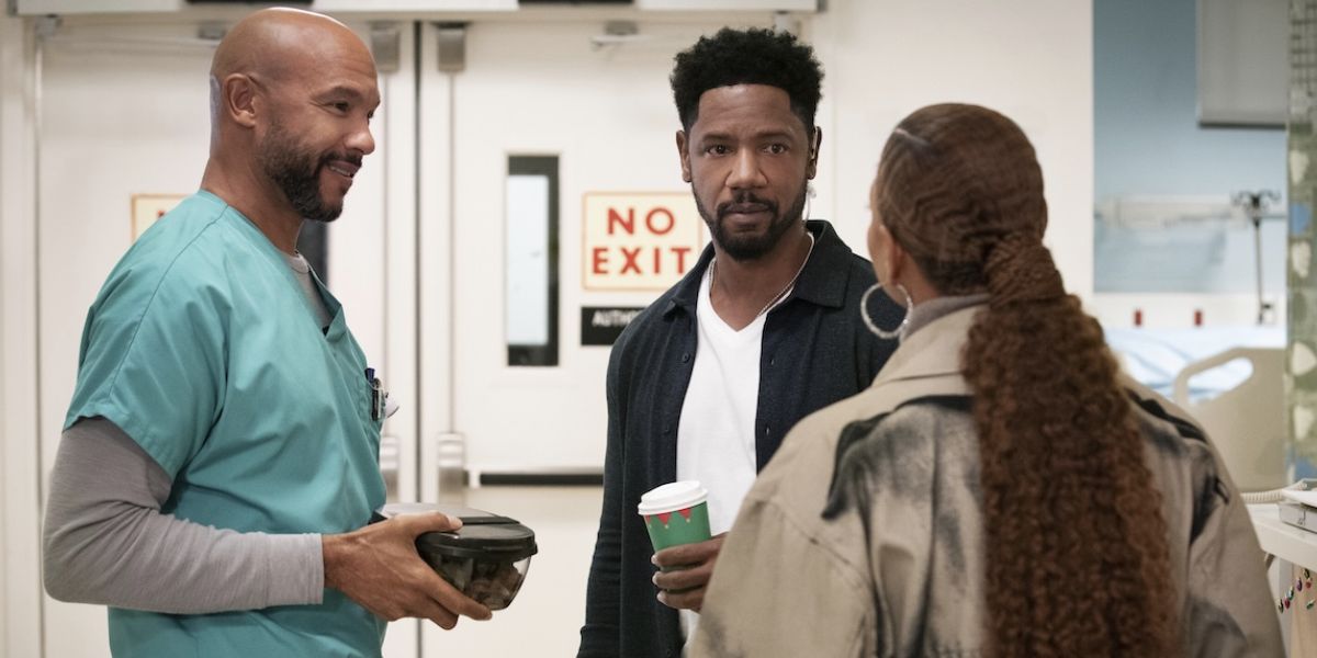 Miles in his scrubs and Dante holding a coffee cup both looking at Robyn.