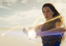 Moiraine holds a ball of light in her hands while preparing to launch it at an unseen enemy on The Wheel of Time Season 3.
