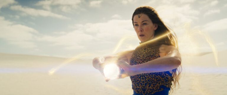 Moiraine holds a ball of light in her hands while preparing to launch it at an unseen enemy on The Wheel of Time Season 3.