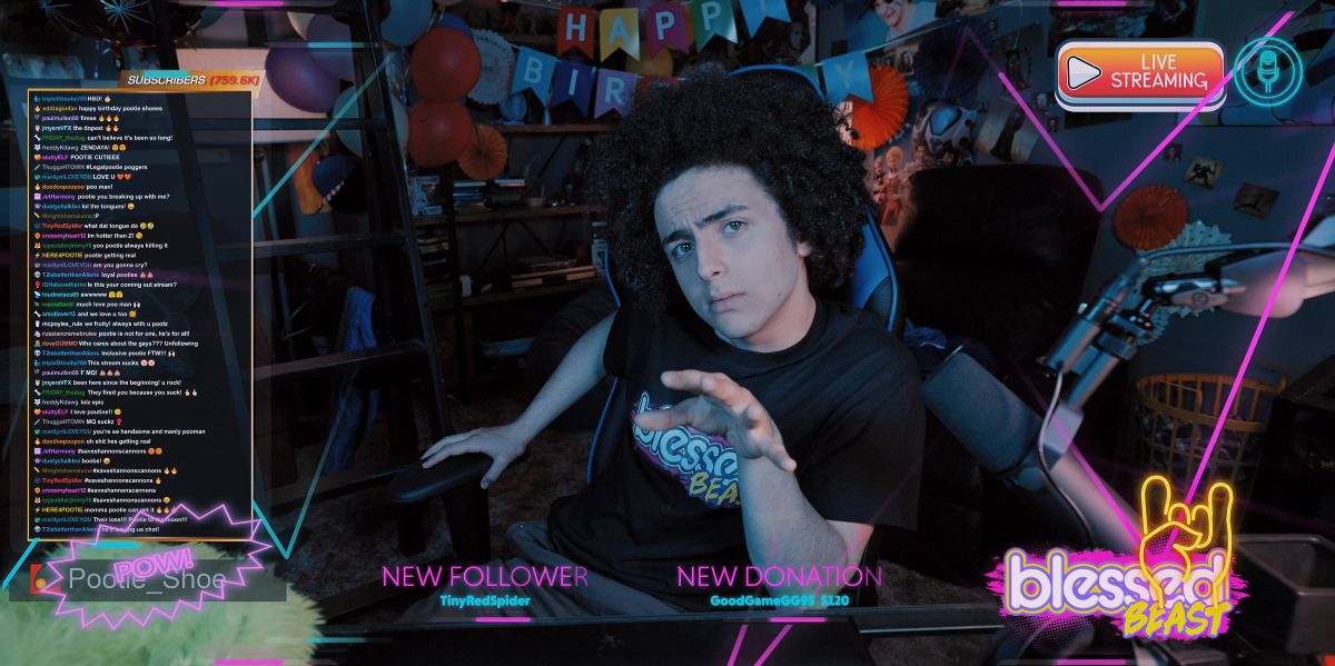 Pootie Shoe sits in his desk chair at his computer during a live stream. His bedroom his behind him. He points at the screen while talking to fans on Mythic Quest Season 4 Episode 8, "Rebrand."