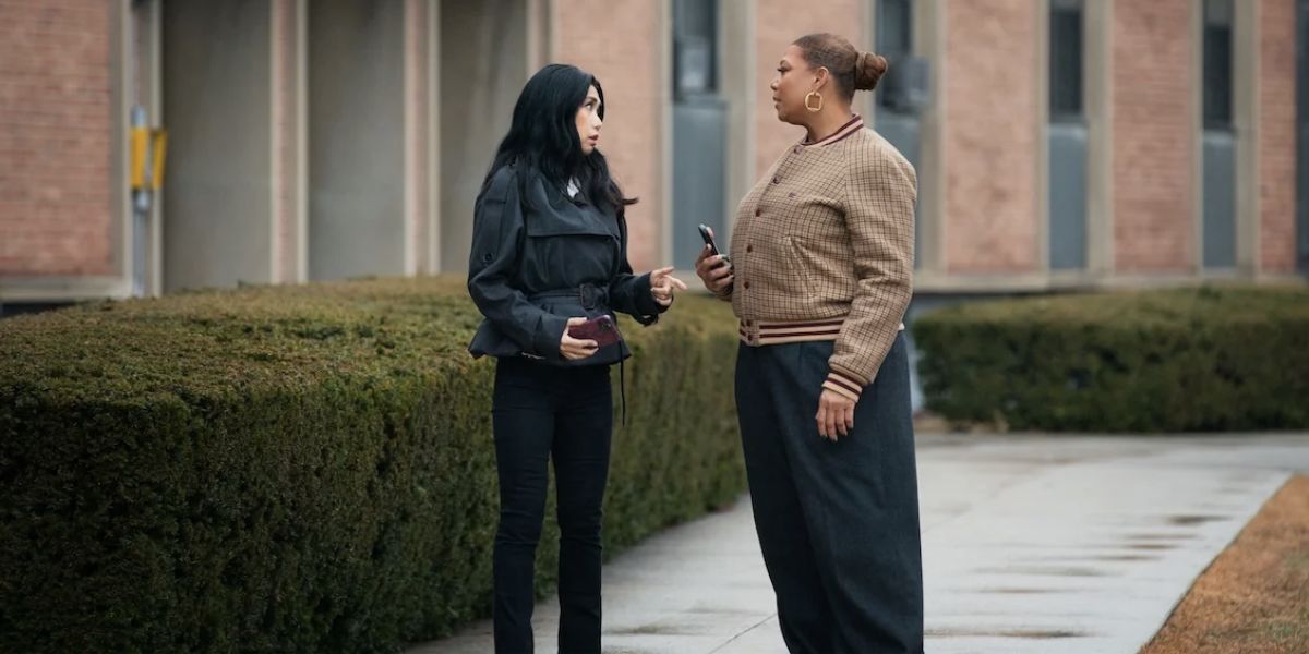 Mel and Robyn talking to each other while standing outside a building on The Equalizer.