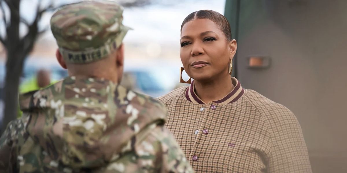 Close up of Robyn speaking to a soldier on "The Equalizer."