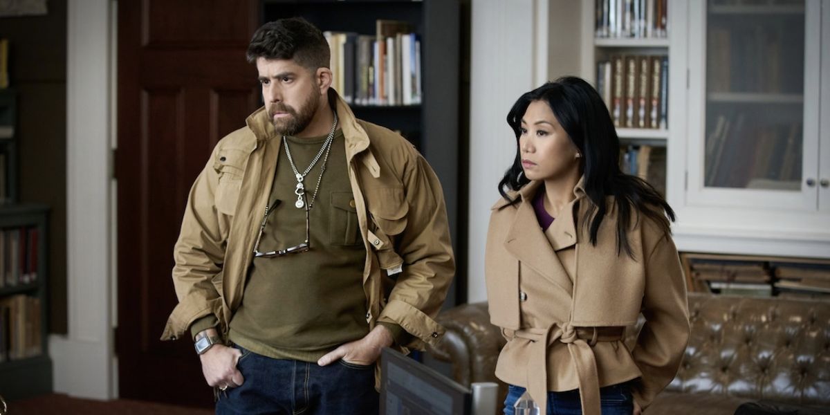 Harry and Mel standing in the dean's office.
