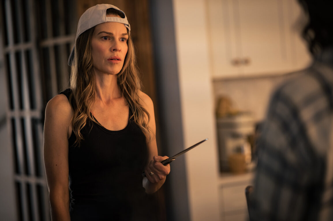 Melissa holds a knife while standing in her kitchen and looking nervous on Yellowjackets Season 3 Episode 9, "How the Story Ends."