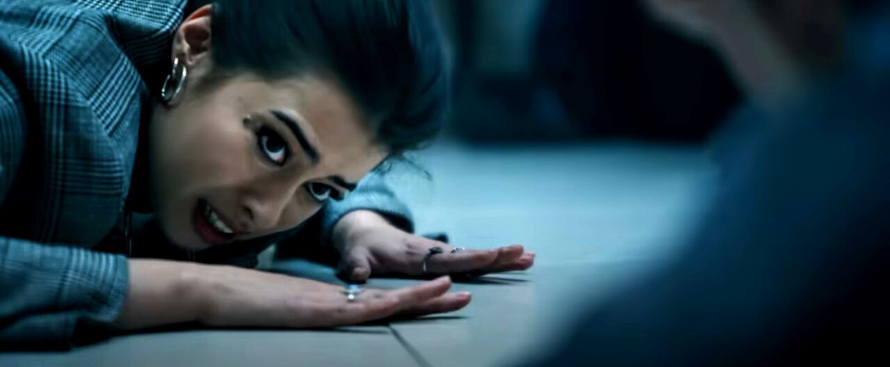 Sherry (Amber Midthunder) stays on the floor during a bank robbery in Novocaine