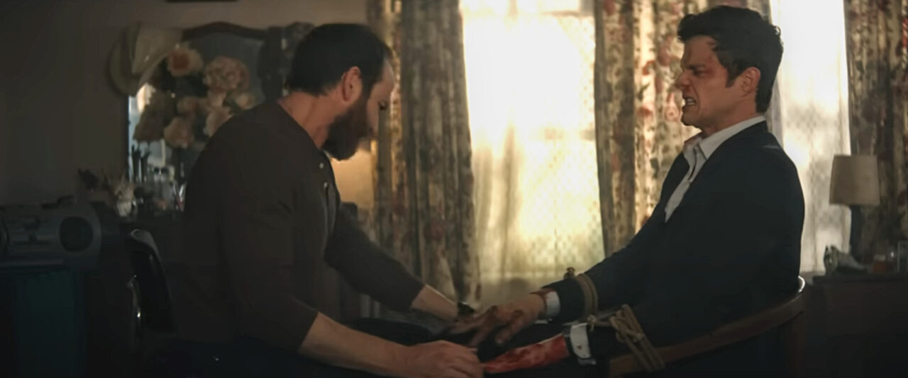 Andre (Conrad Kemp) tortures Nate (Jack Quaid)