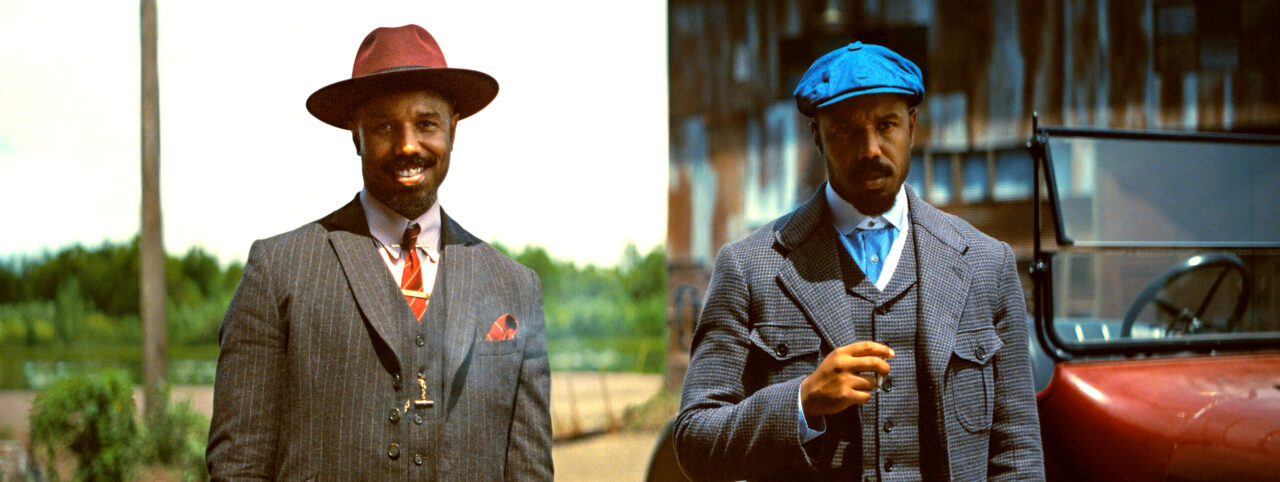Stack and Smoke (Michael B. Jordan) wait for a business meeting in Sinners
