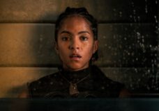 A closeup of a young Black woman who looks forward, a pensive expression on her face, in Foundation Season 3.