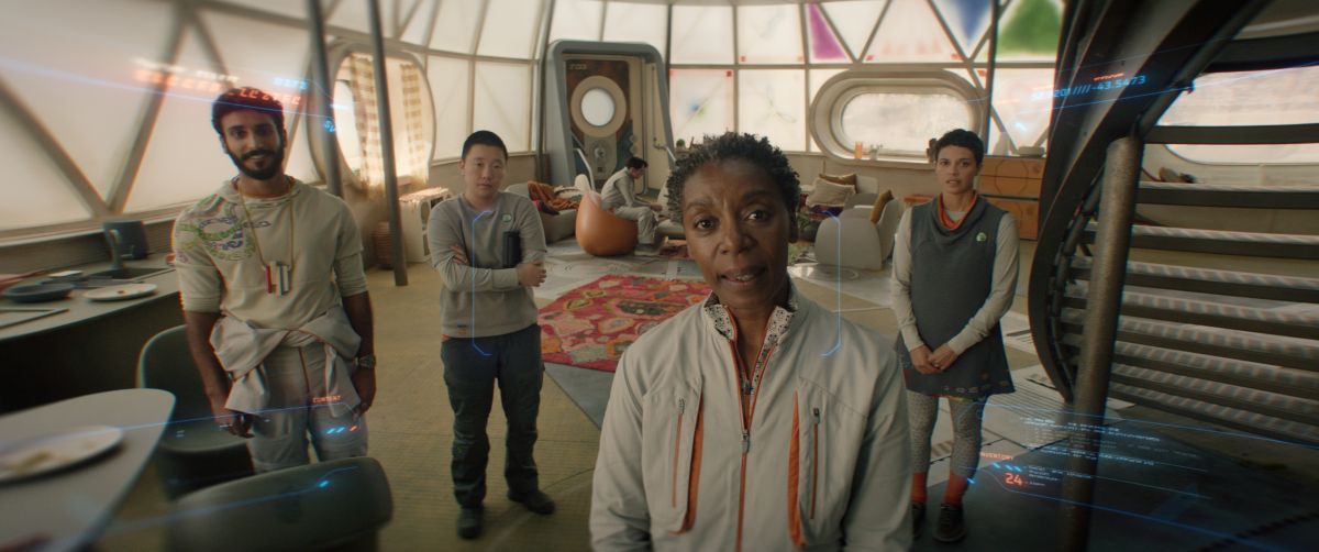 Ratthi, Pin-Lee, Mensah and Arada stand in their apartments while looking at their SecUnit. We see them through the SecUnit's eyes on Murderbot Season 1 Episode 1, "FreeCommerce."