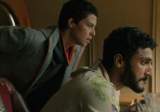 Arada leans over Ratthi as he sits at the control panel for the hopper and looks panicked on Murderbot Season 1 Episode 4, "Escape Velocity Protocol."