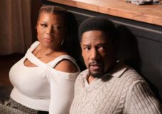 Robyn and Dante hiding behind a kitchen counter on "The Equalizer."