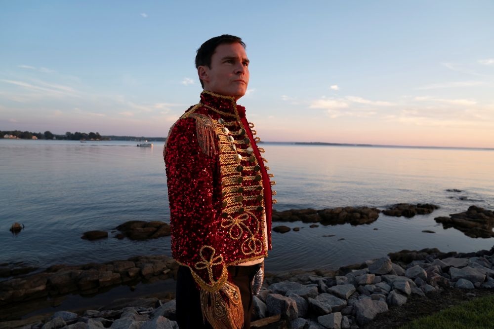 Corey wears a Michael Jackson costume while standing outside near a lake in the evening on The Righteous Gemstones Season 4 Episode 9, "That Man of God May Be Complete."