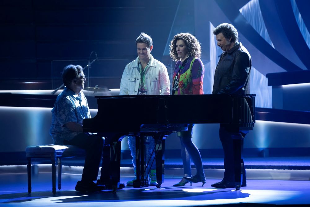 Eli sits at a piano on the church stage while Kelvin, Judy and Jesse stand around him on The Righteous Gemstones series finale.