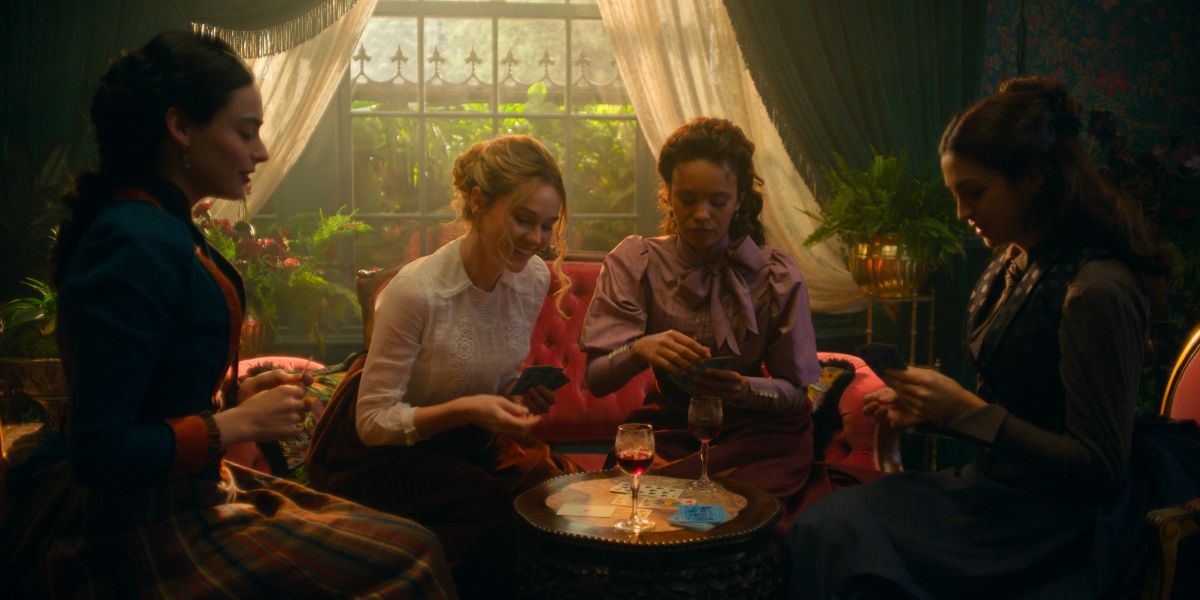 Lizzy, Jinny, Conchita and Mabel sit together in a naturally lit sitting room while chatting on The Buccaneers Season 2 Episode 7, "All Rise."