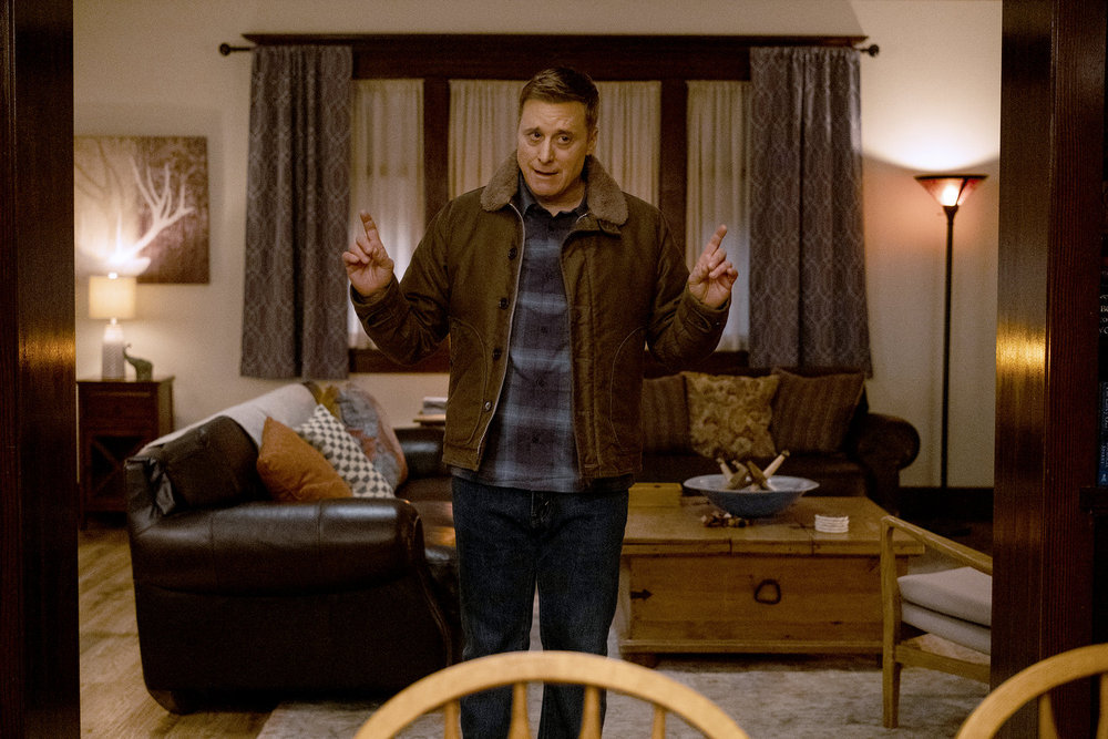 Harry gestures while standing in Asta and D'arcy's house on Resident Alien Season 4 Episode 10, "The End Is Here."